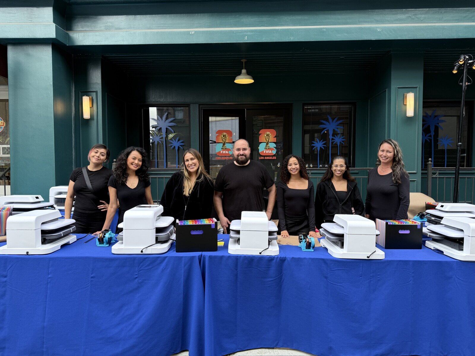 Full-color DTF t-shirt being printed live at an event station