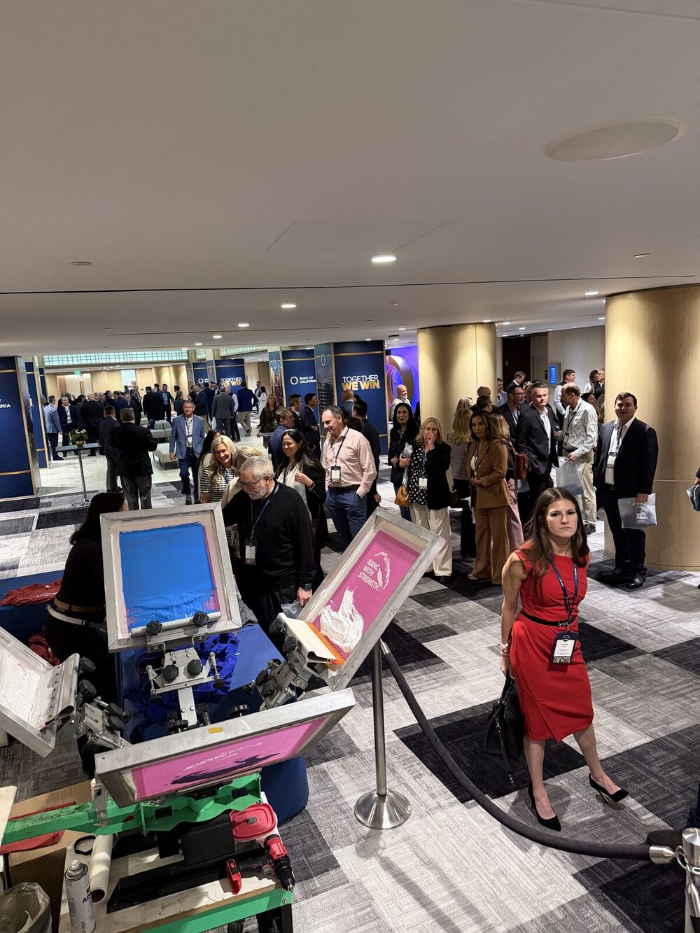 Busy live press stations working an event crowd